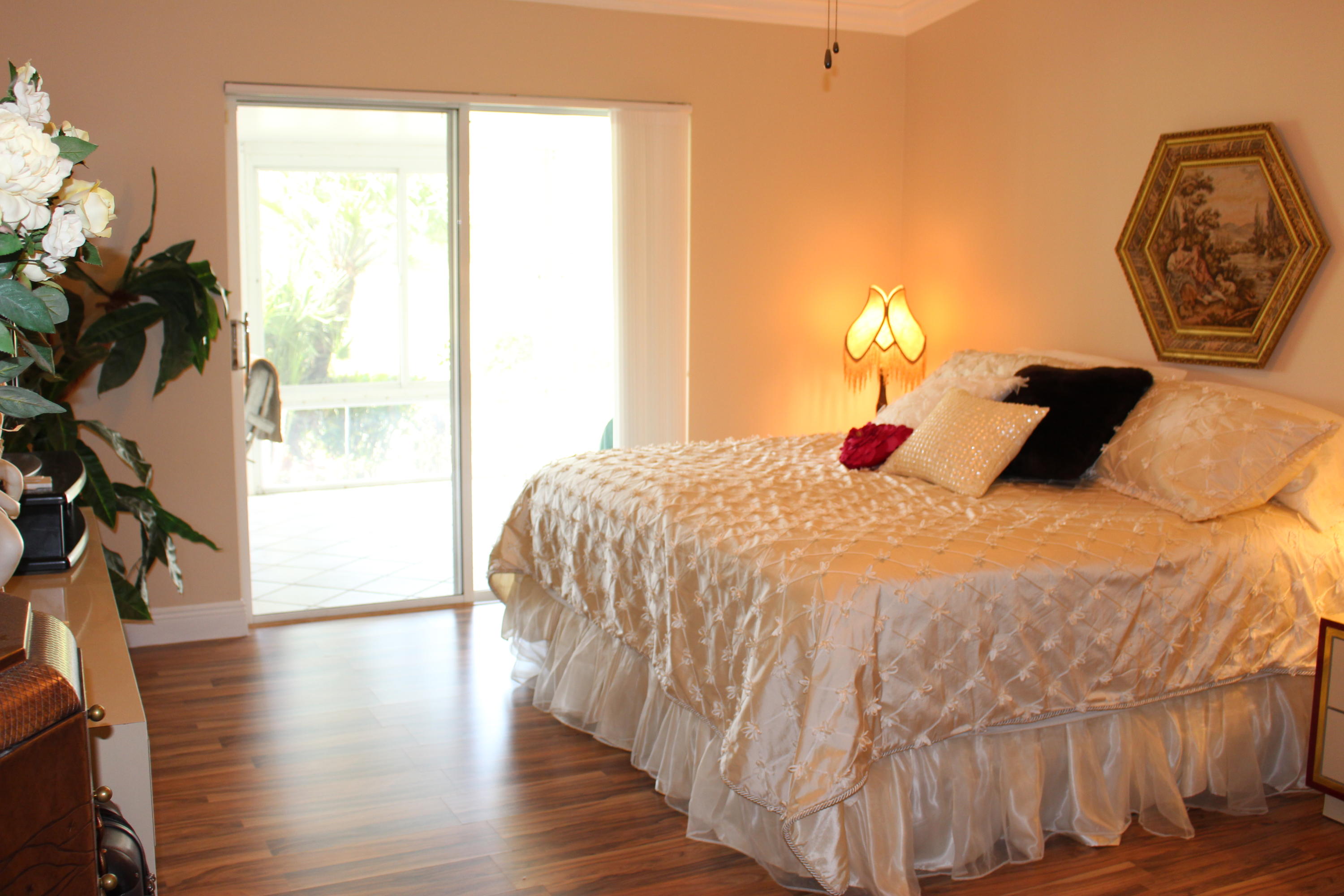 10012 Country Brook Road Boca Raton, FL 33428 - Photo 18 of 25 a bedroom with a bed and a window