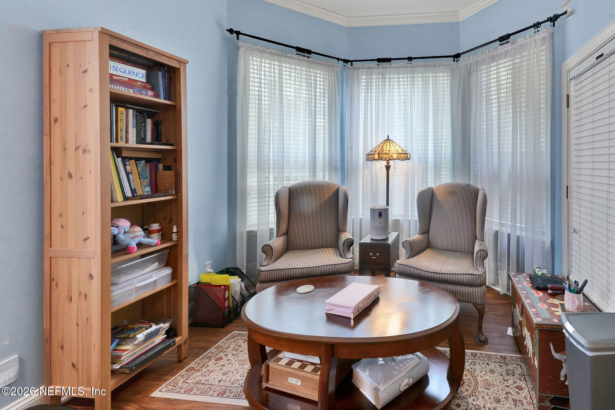 5950 West Shores Road Orange Park, FL 32003 - Photo 21 of 42 a living room with furniture and a window