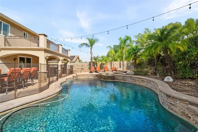 a view of backyard of house with seating space