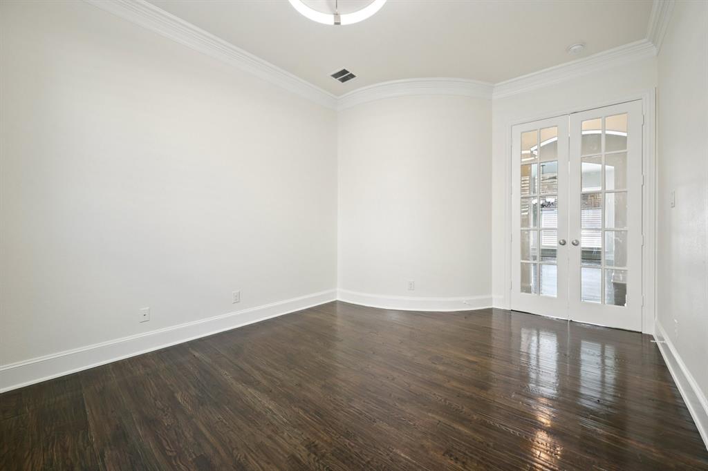 2029 Temperate Drive Allen, TX 75013 - Photo 19 of 40 a view of an empty room with wooden floor and a window