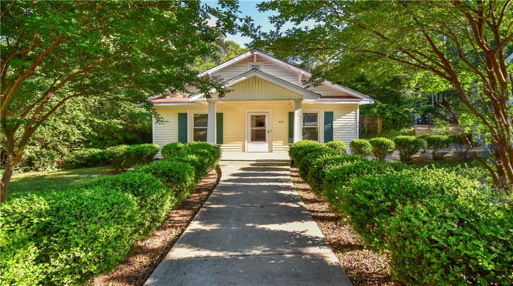 Adorable bungalow in hot Historic Marietta location! Ample parking and deep lot! So much charm!