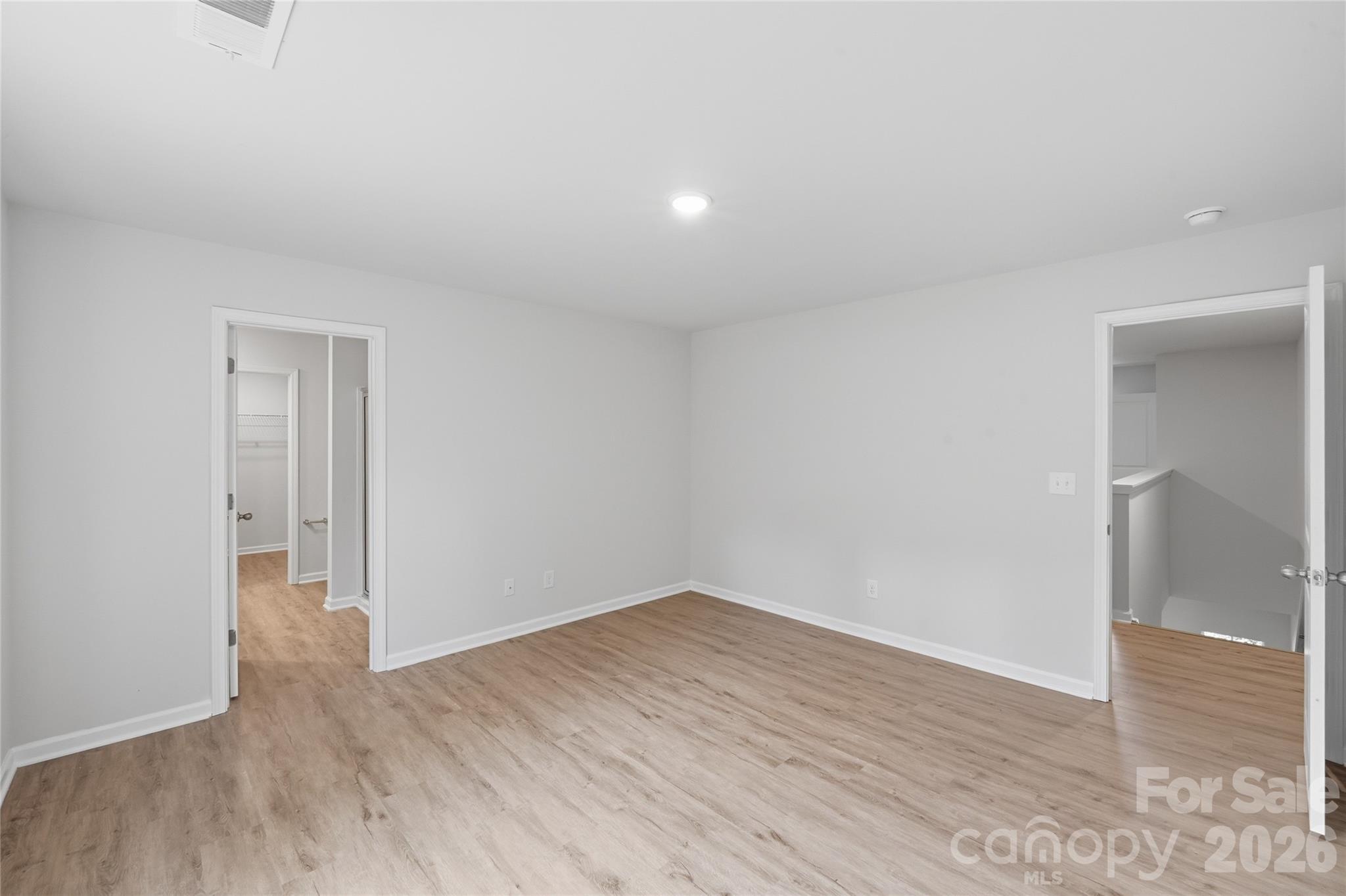 242 Landers Chapel Road Lincolnton, NC 28092 - Photo 26 of 33 wooden floor in a hall with an empty room