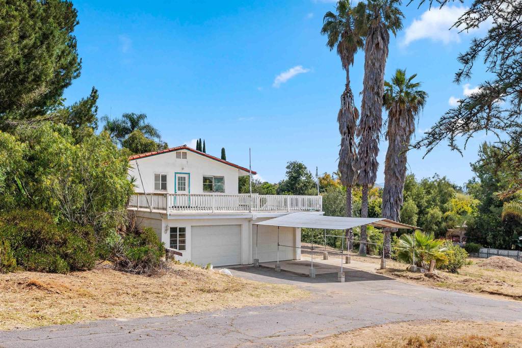 1420 Calavo Road Fallbrook, CA 92028 - Photo 1 of 1 a white house with a tree in the background