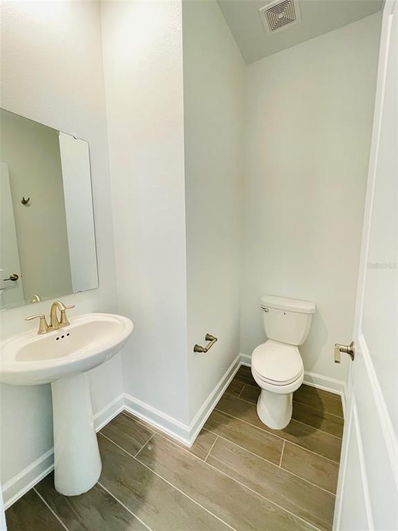 11732 Language Way Orlando, FL 32832 - Photo 11 of 24 a bathroom with a sink and a toilet