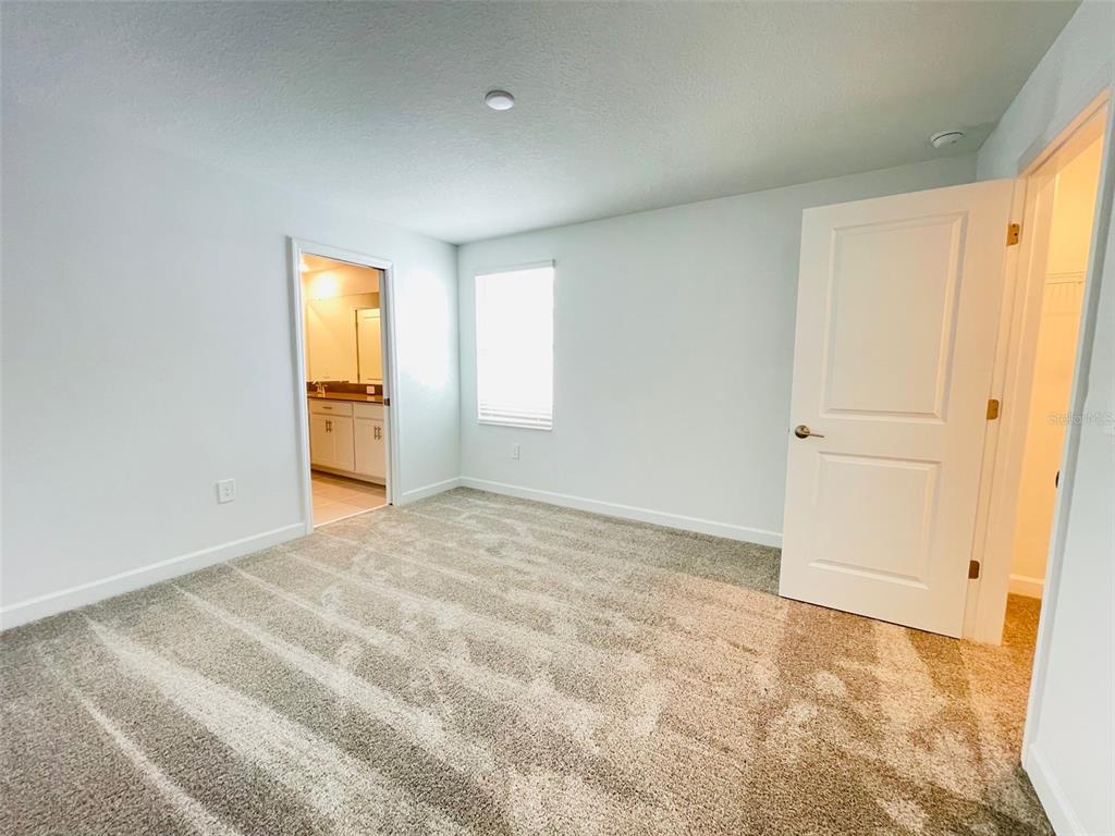 11732 Language Way Orlando, FL 32832 - Photo 16 of 24 a view of an empty room and window