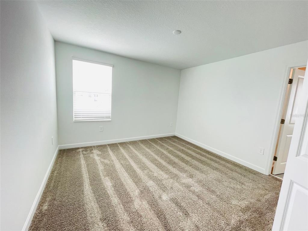 11732 Language Way Orlando, FL 32832 - Photo 18 of 24 an empty room with a window