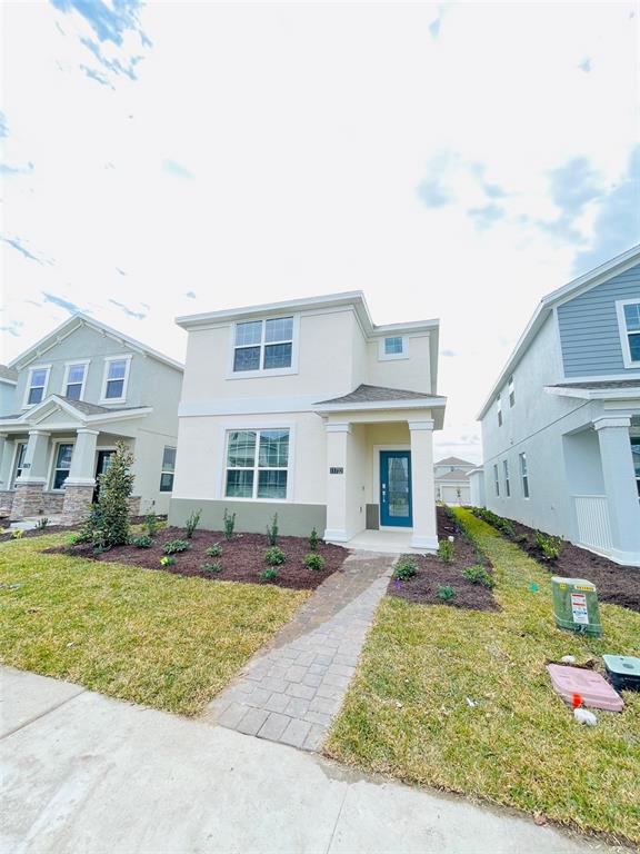11732 Language Way Orlando, FL 32832 - Photo 4 of 24 a front view of house with yard