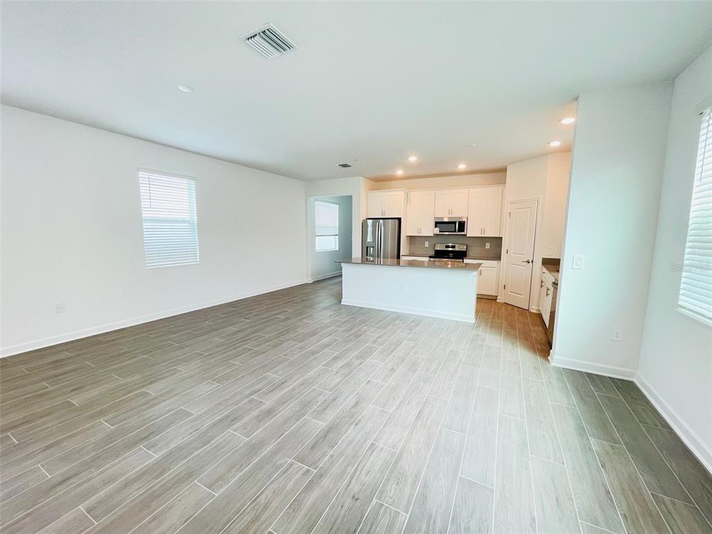 11732 Language Way Orlando, FL 32832 - Photo 10 of 24 a view of a kitchen with wooden floor