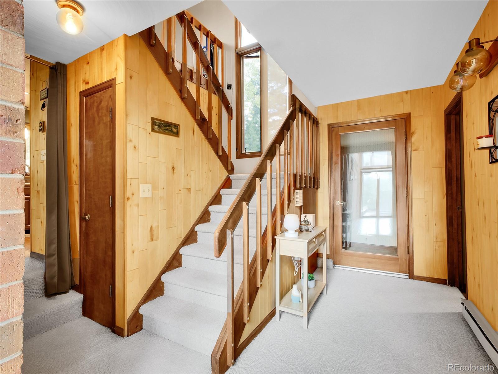 29752 Bearcat Trail Conifer, CO 80433 - Photo 24 of 50 a view of an entryway with staircase