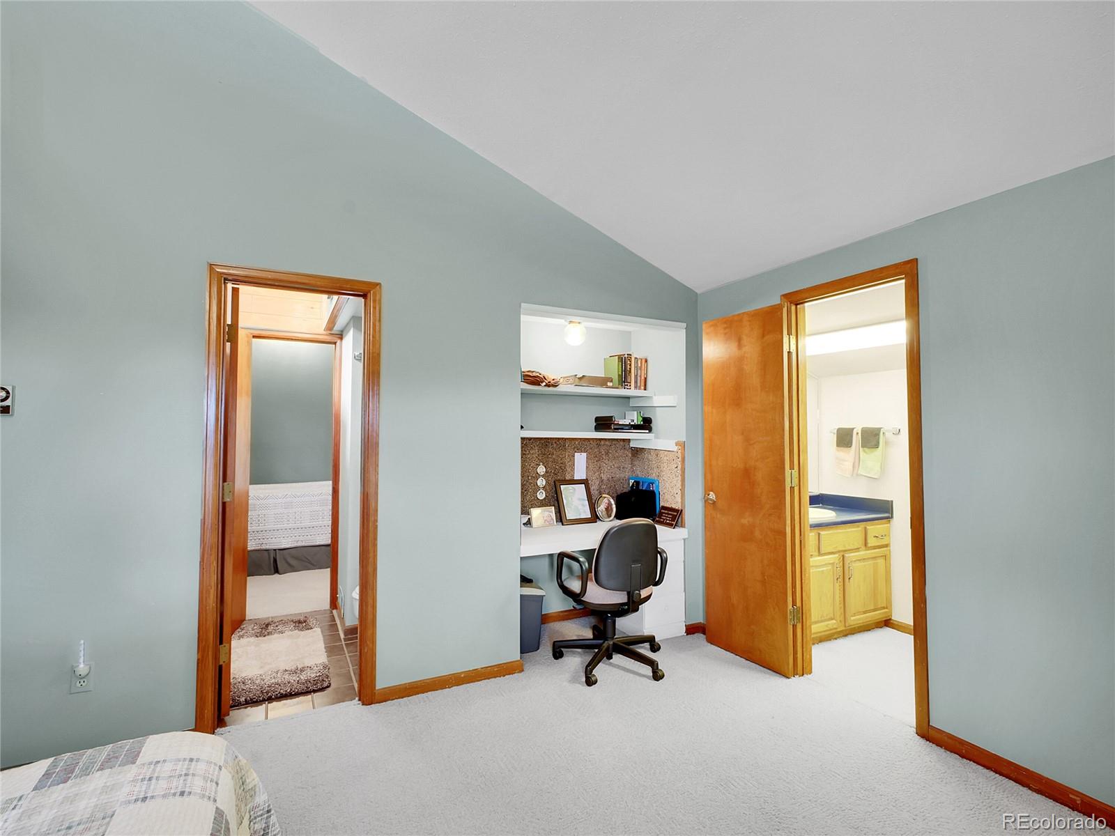 29752 Bearcat Trail Conifer, CO 80433 - Photo 37 of 50 a view of a workspace with furniture and a window