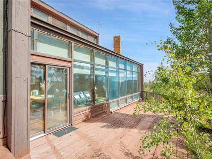 a bathroom with a glass door and shower