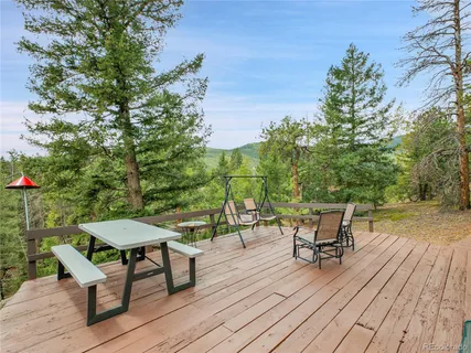 a view of a chairs and table on the wooden floor