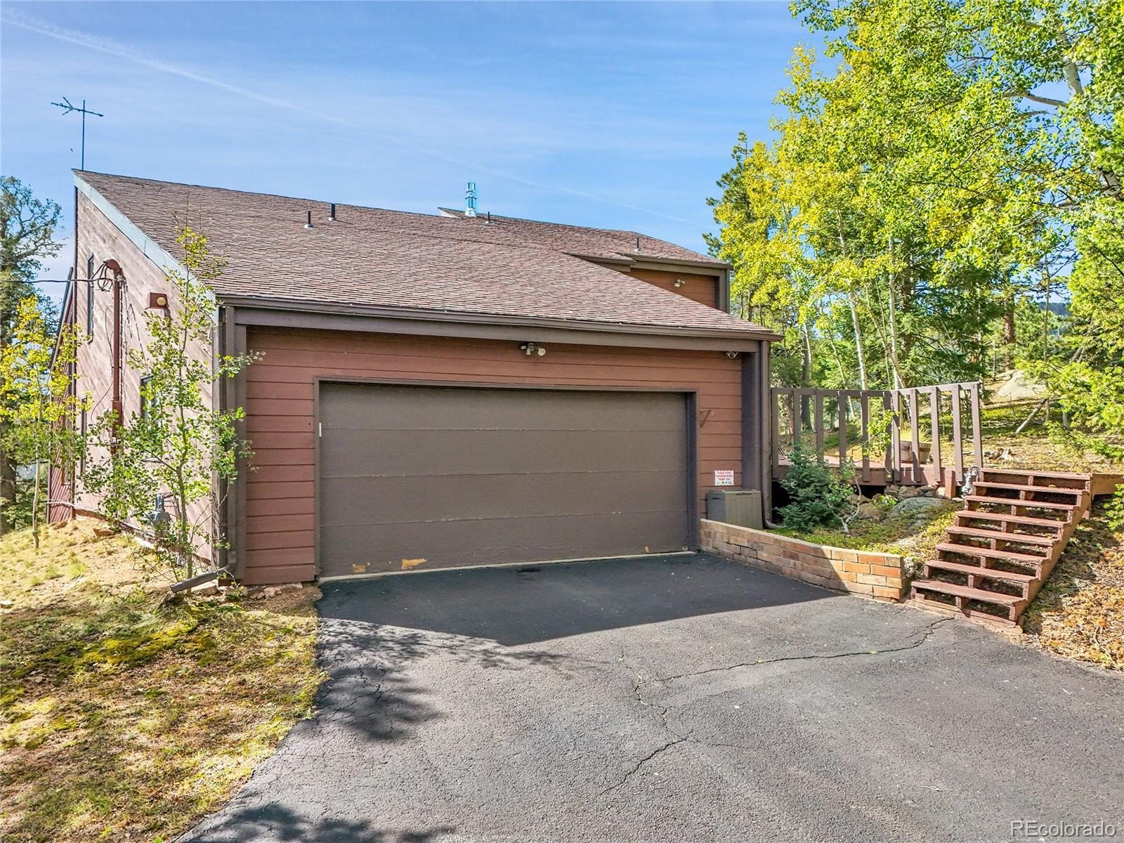 29752 Bearcat Trail Conifer, CO 80433 - Photo 45 of 50 a front view of a house
