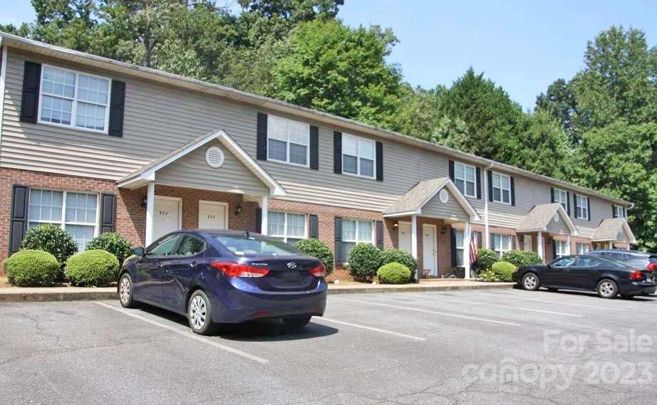 972-986 8th Avenue Northwest Hickory, NC 28601 - Photo 1 of 8 a front view of a house with a garden