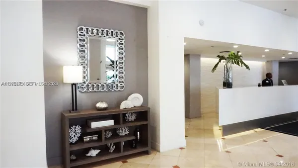 a bathroom with a sink a mirror and vanity