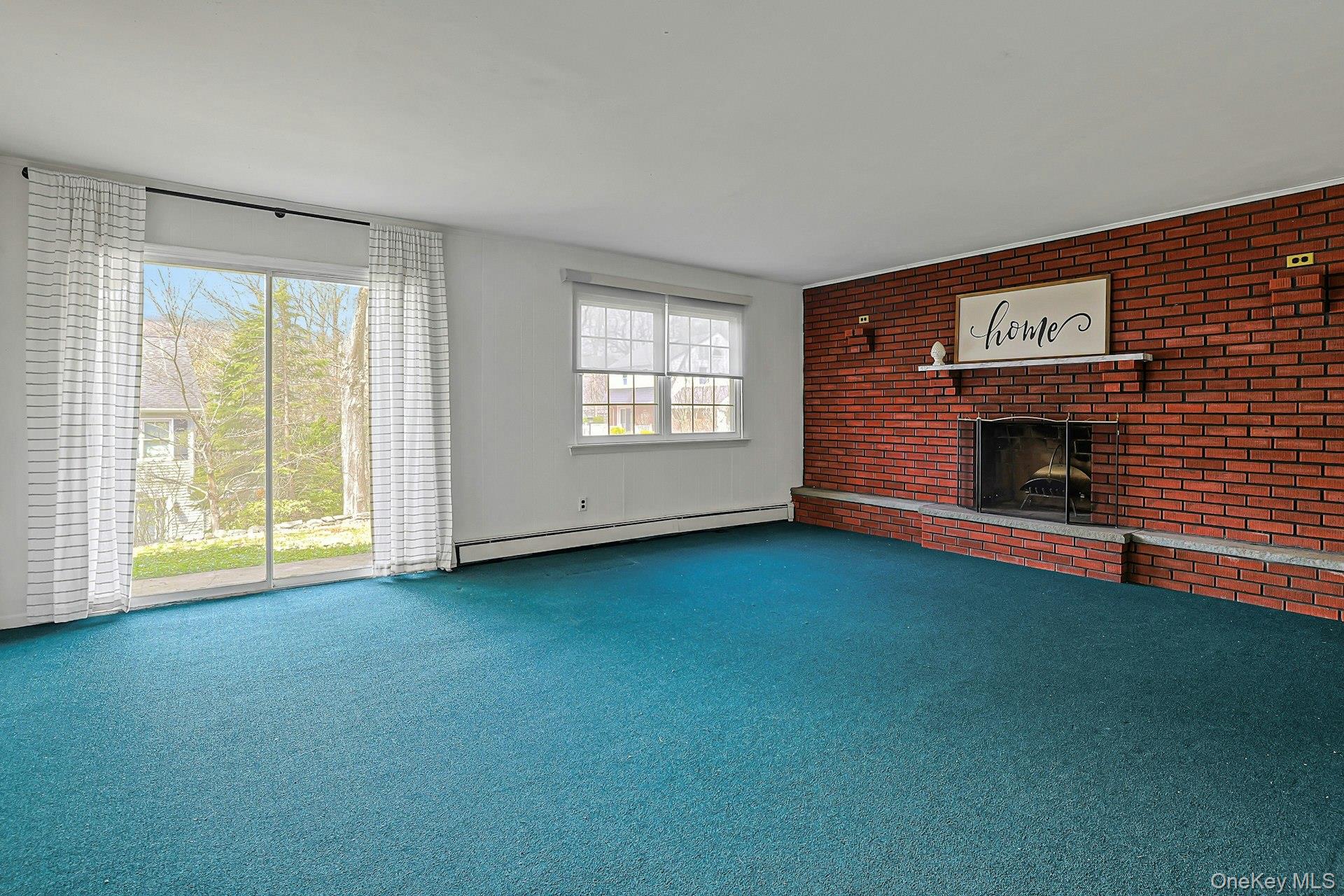 60 Pine Street Ardsley, NY 10607 - Photo 30 of 43 Family Room With Sliders to the Patio and Brick Fireplace