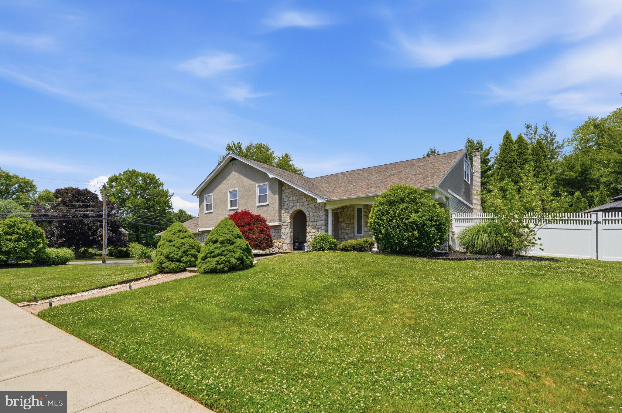 1002 Tannerie Run Road Ambler, PA 19002 - Photo 3 of 67 Charming home with lush greenery.