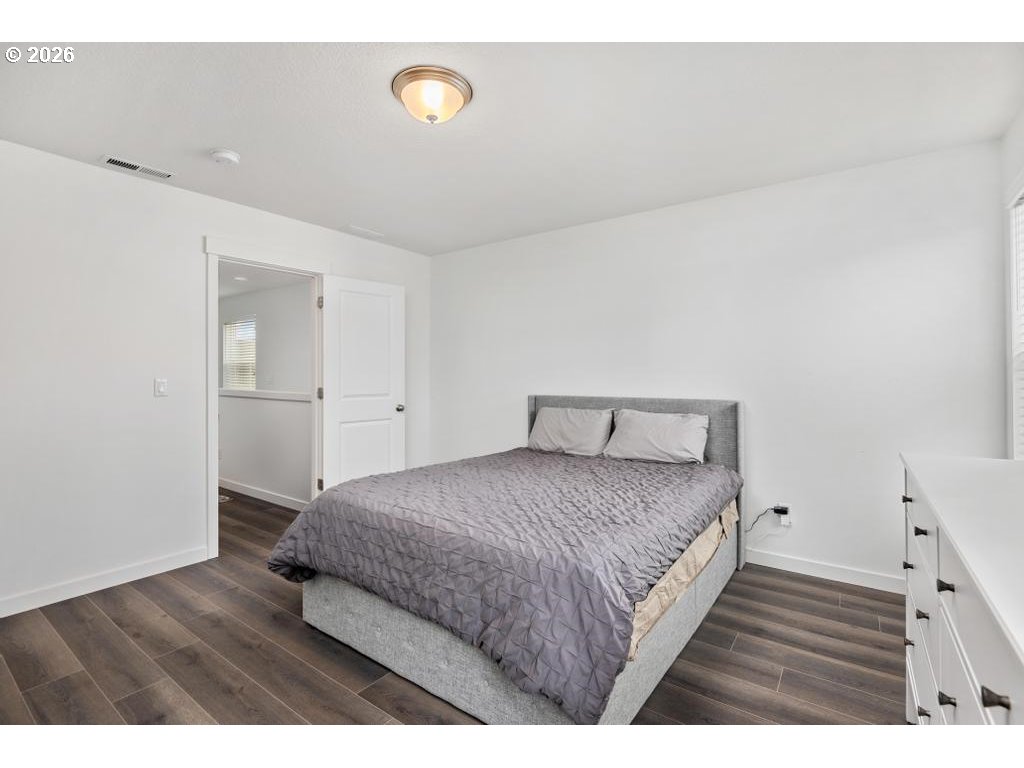 859 South 23rd Avenue Cornelius, OR 97113 - Photo 17 of 39 a bedroom with a bed and a night stand