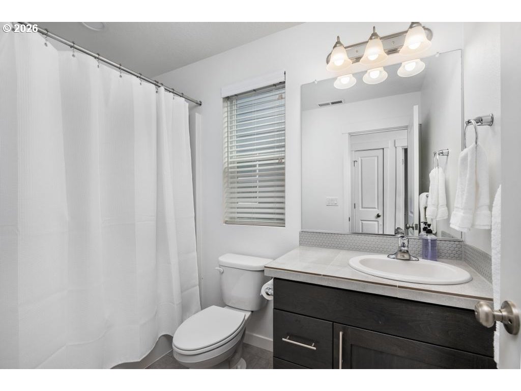 859 South 23rd Avenue Cornelius, OR 97113 - Photo 30 of 39 a bathroom with a sink vanity mirror and toilet