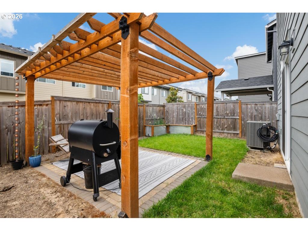 859 South 23rd Avenue Cornelius, OR 97113 - Photo 34 of 39 a view of backyard with a patio and a garden