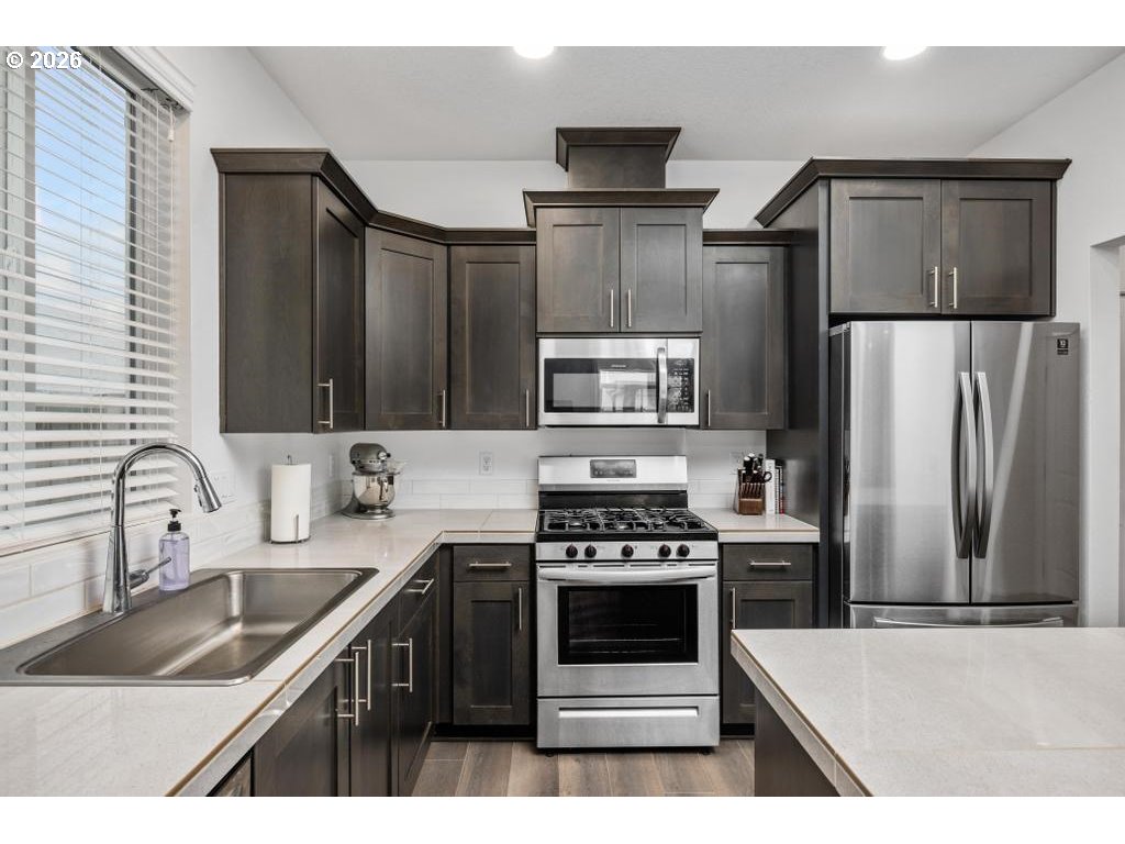 859 South 23rd Avenue Cornelius, OR 97113 - Photo 9 of 39 a kitchen with a sink appliances and cabinets