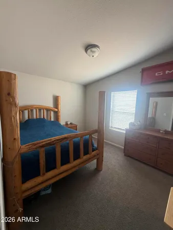 a living room with furniture pool table and a window