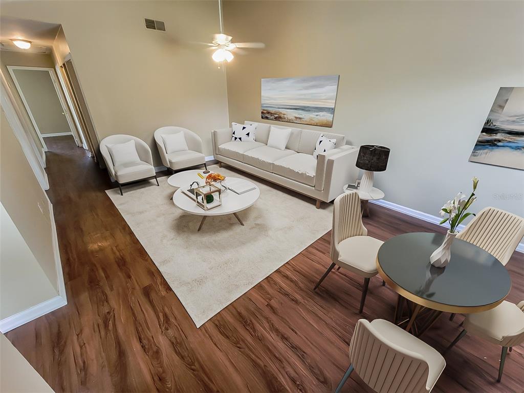22794 Penny Loop Land O' Lakes, FL 34639 - Photo 1 of 1 a living room with furniture and wooden floor