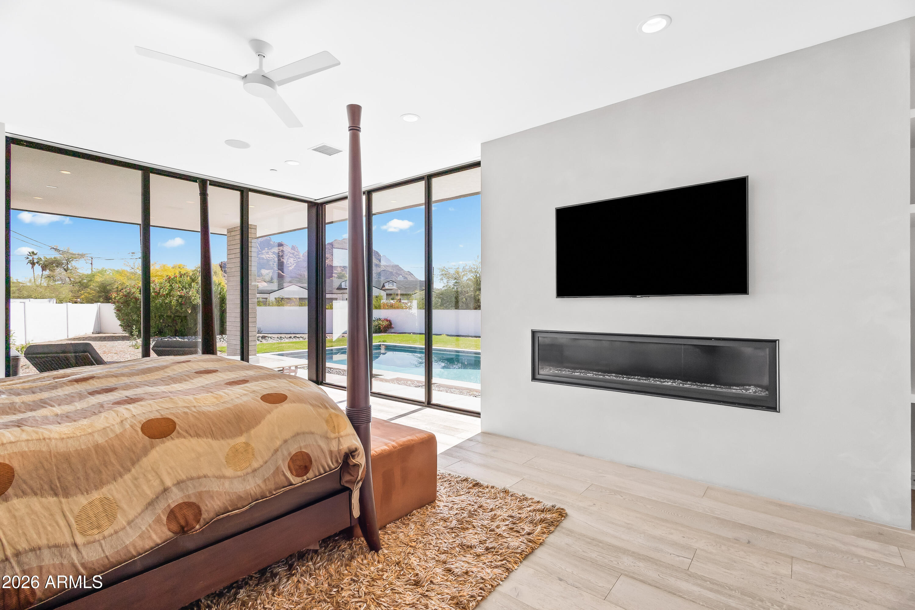 5430 North 41st Street Phoenix, AZ 85018 - Photo 14 of 38 a bedroom with a bed and a flat screen tv