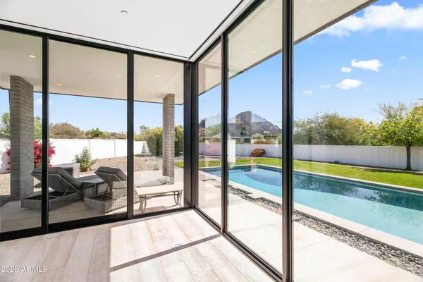 a view of a room with yard from a balcony