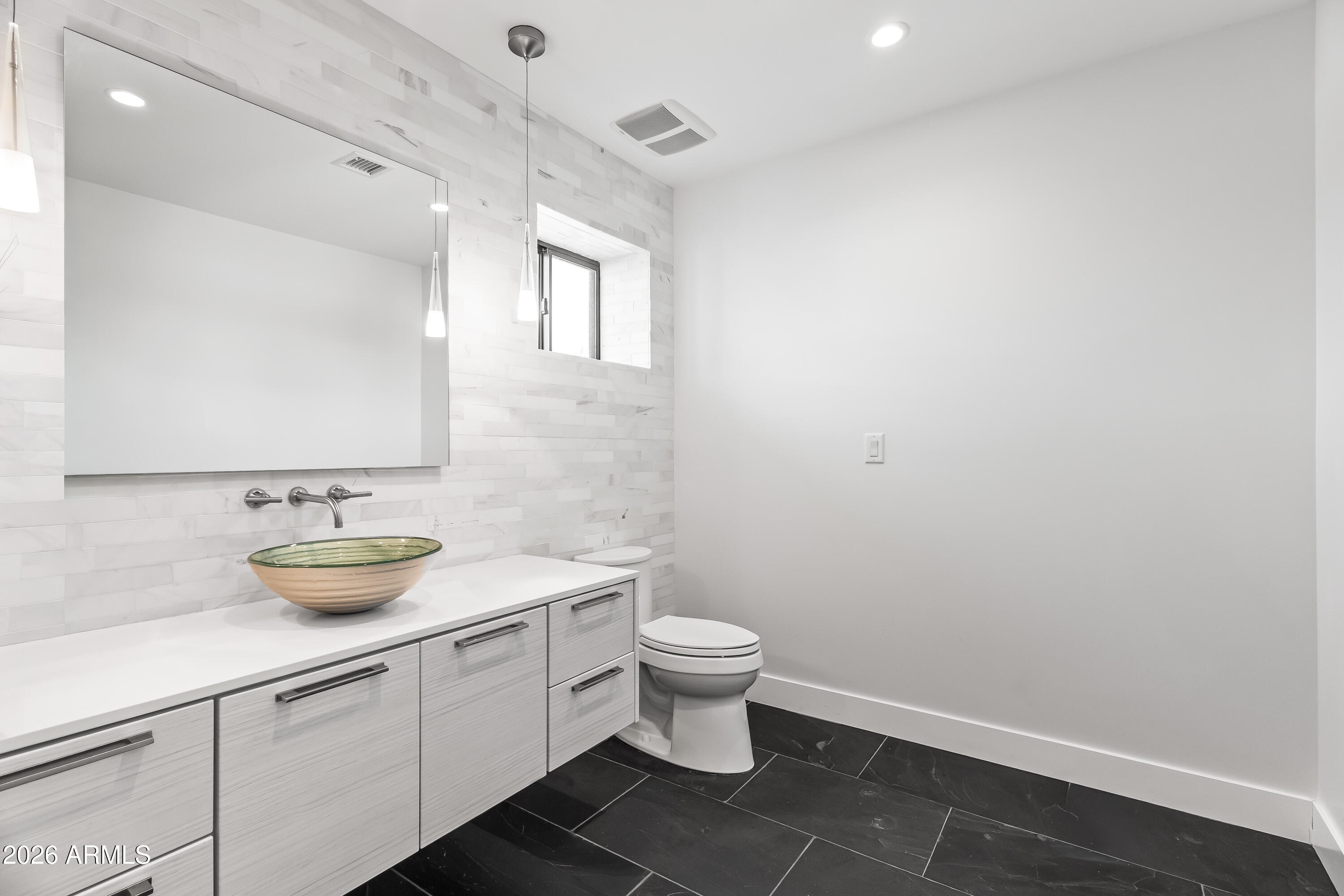 5430 North 41st Street Phoenix, AZ 85018 - Photo 21 of 38 a bathroom with a toilet and a sink