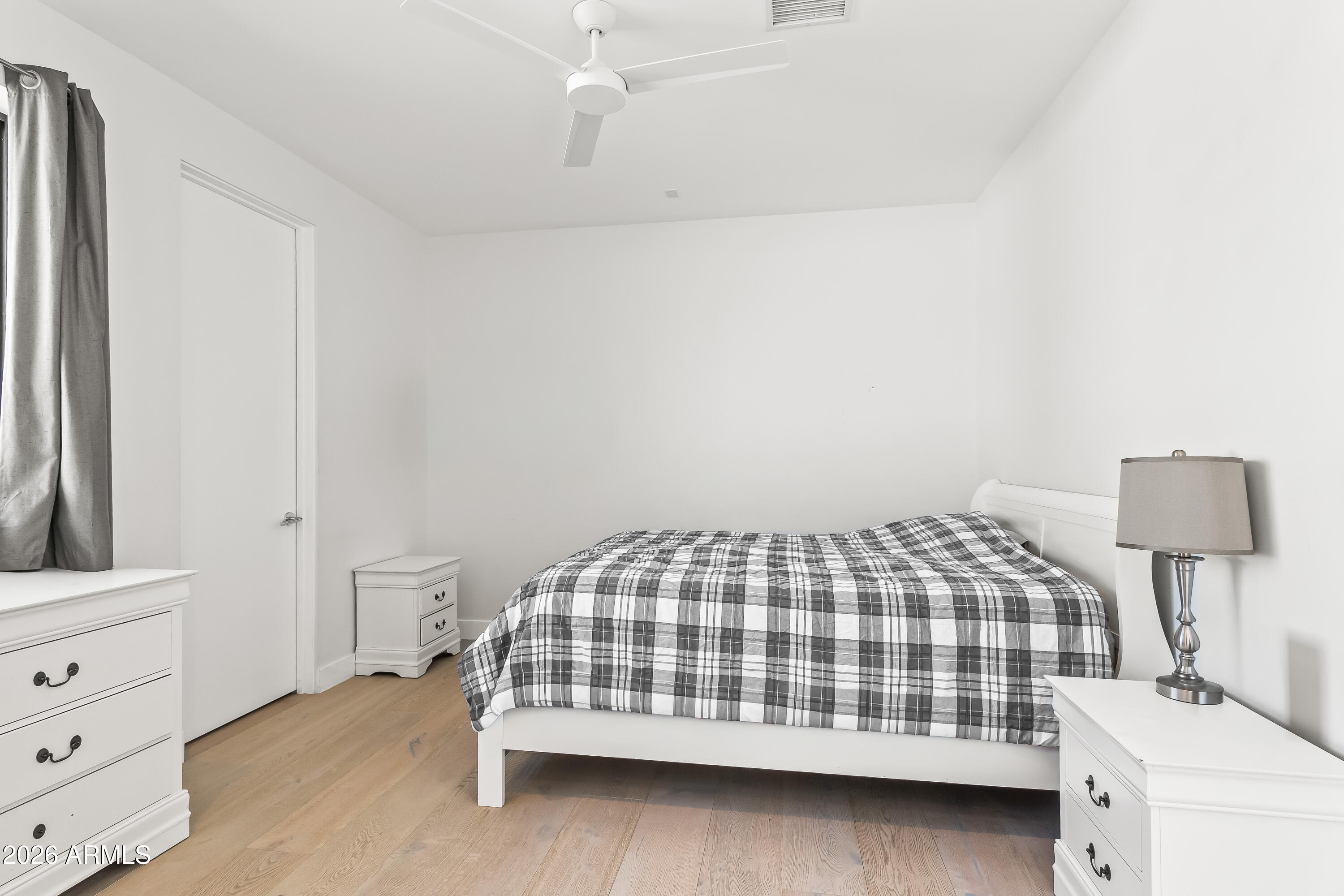 5430 North 41st Street Phoenix, AZ 85018 - Photo 22 of 38 a bedroom with a bed and a night stand