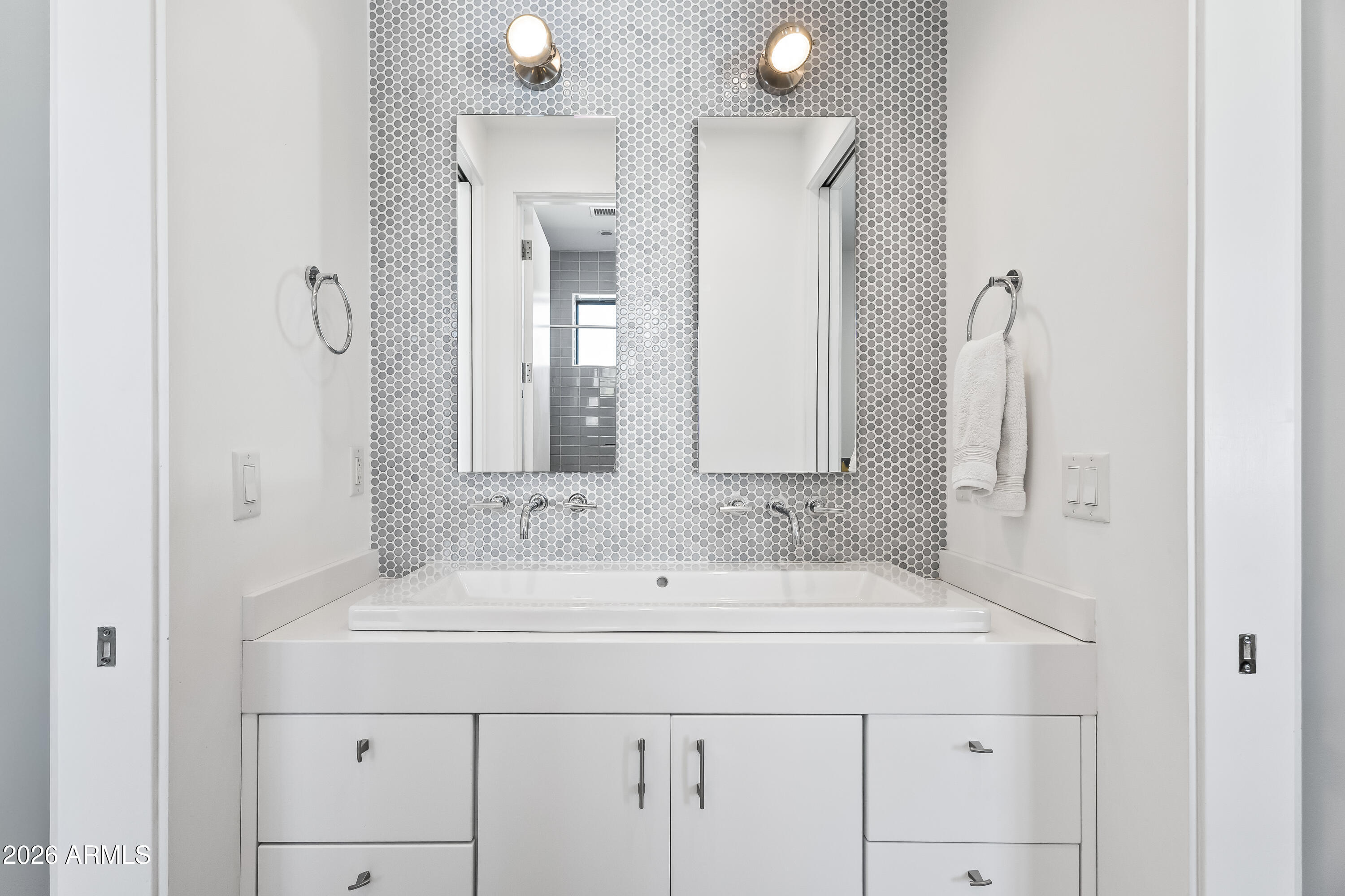 5430 North 41st Street Phoenix, AZ 85018 - Photo 23 of 38 a bathroom with a sink and a mirror
