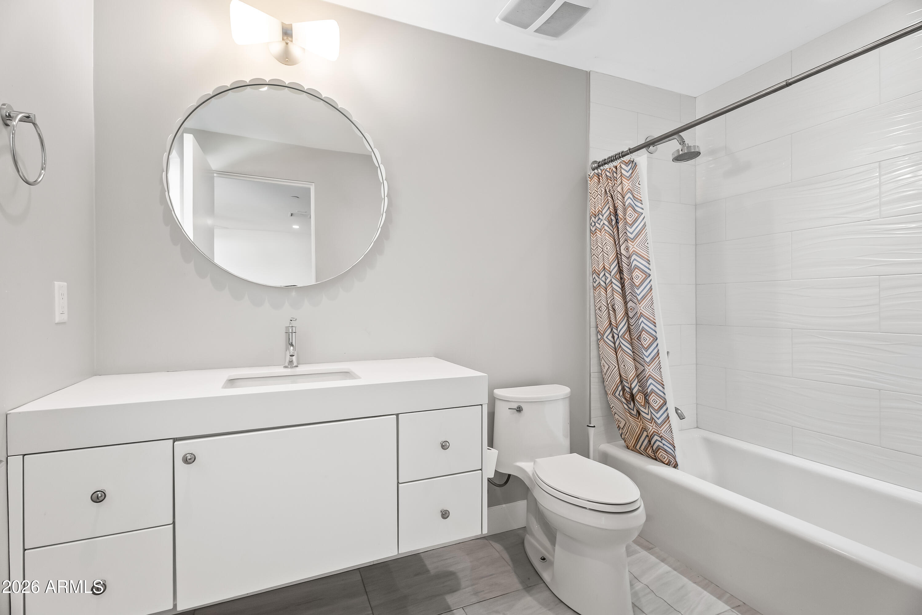5430 North 41st Street Phoenix, AZ 85018 - Photo 25 of 38 a bathroom with a toilet sink vanity tub and shower