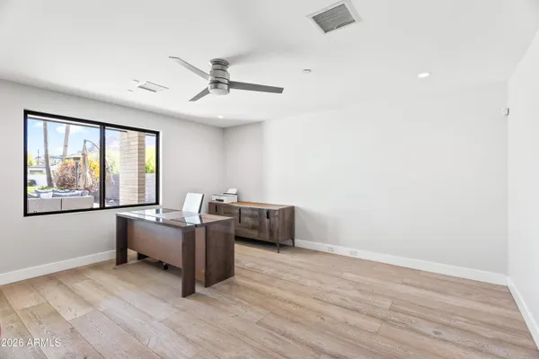 a workspace with furniture and window