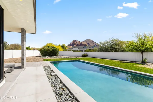 a view of swimming pool with a yard