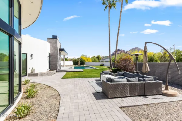 a view of a swimming pool with a lounge chairs