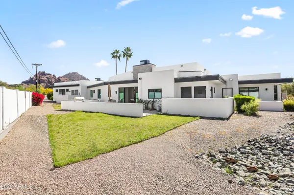 a swimming pool with buildings in the background