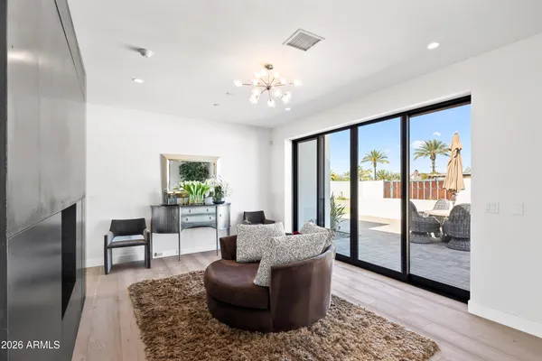a living room with furniture and a large window