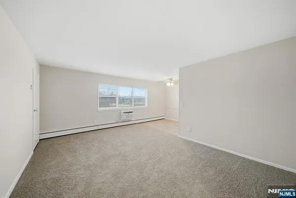 an empty room with a empty space and window