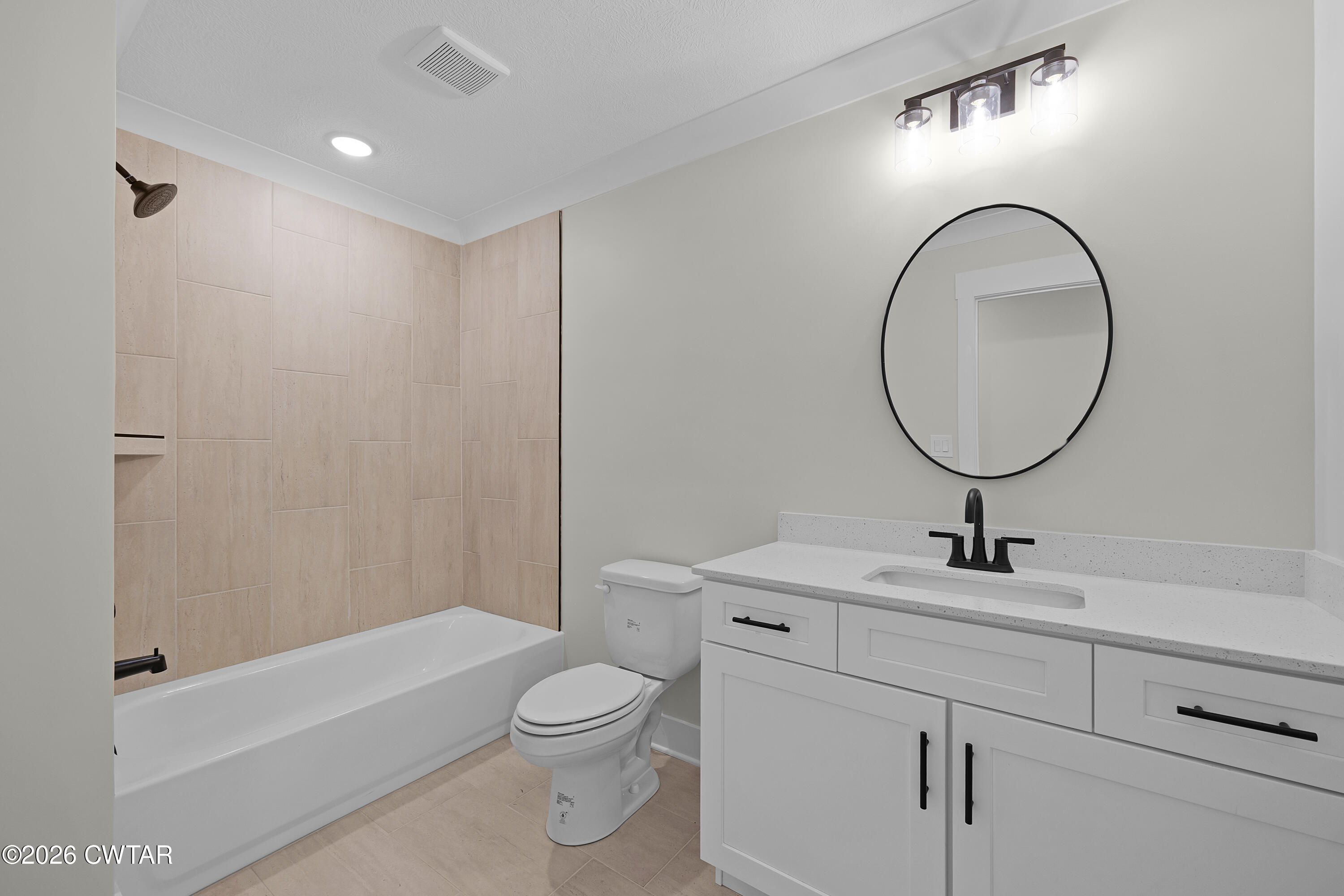 404 Fairway Boulevard Jackson, TN 38305 - Photo 15 of 16 a bathroom with a toilet sink and mirror