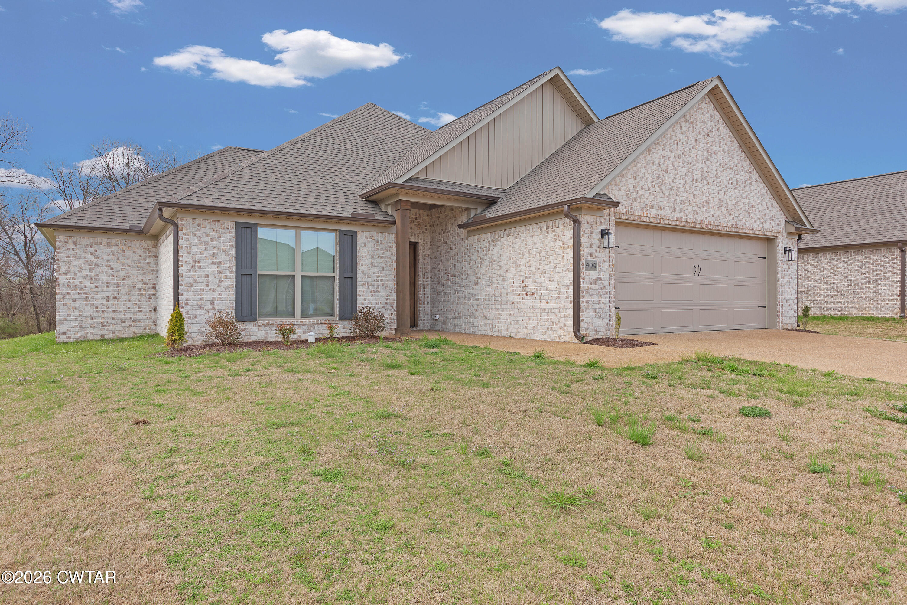 404 Fairway Boulevard Jackson, TN 38305 - Photo 2 of 16 a view of a house with a yard