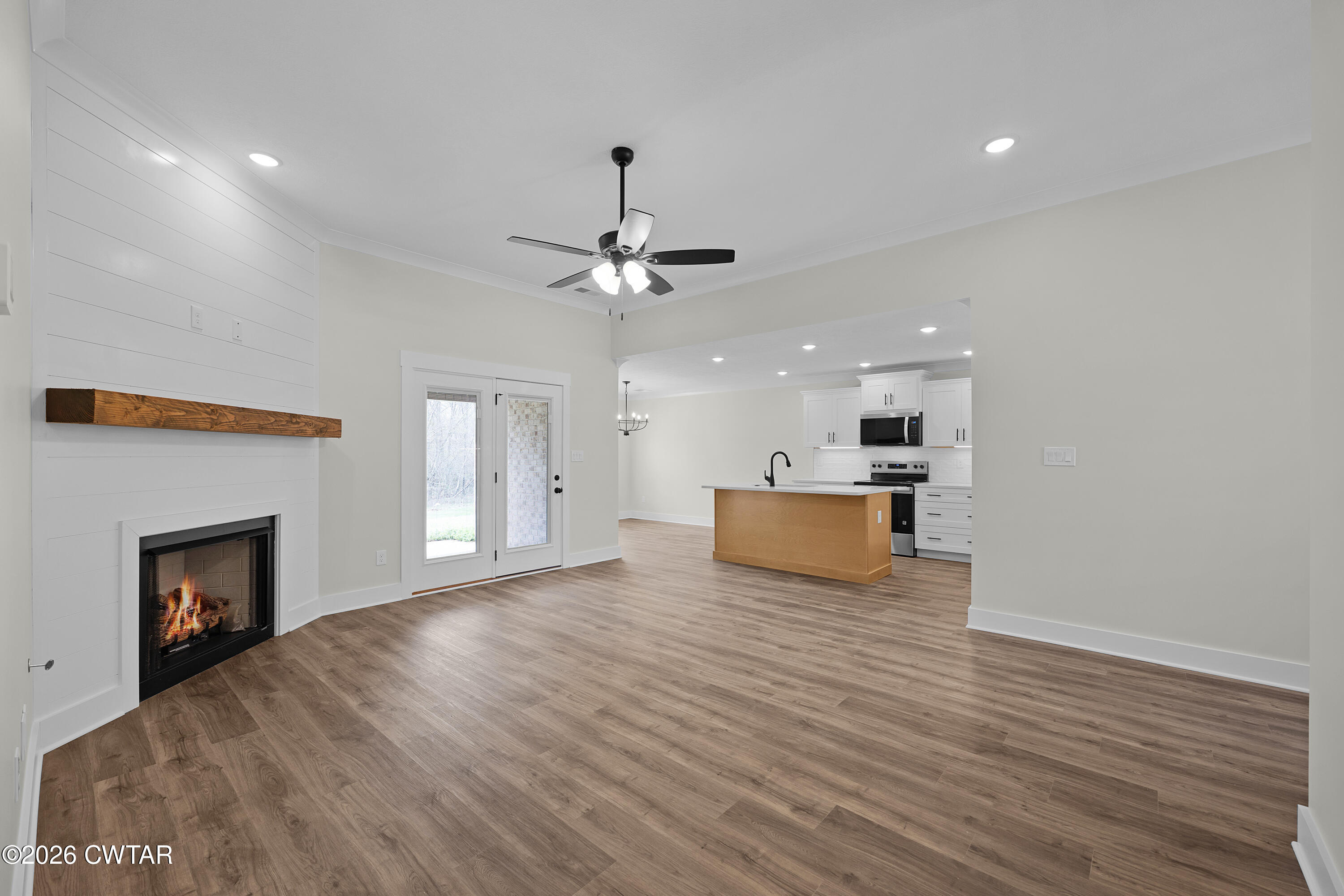 404 Fairway Boulevard Jackson, TN 38305 - Photo 5 of 16 a view of a kitchen with a sink and a fireplace