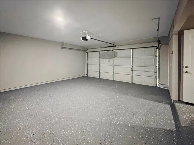 an empty room with a empty space and windows