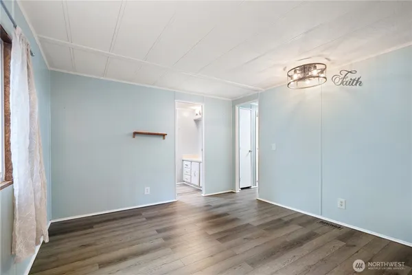 an empty room with wooden floor