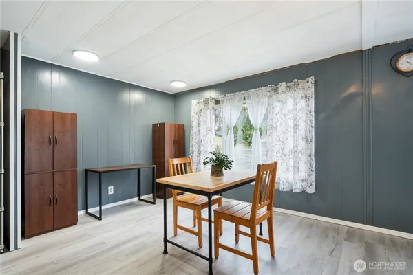 a dining room with furniture and window