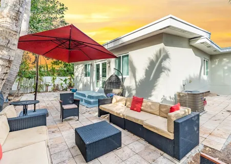 a outdoor space with patio the couches and a umbrella