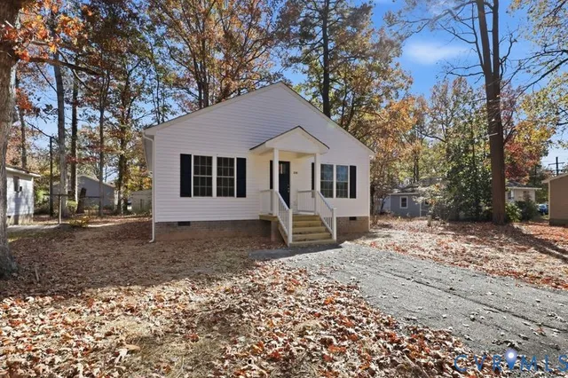 a house with trees in the background