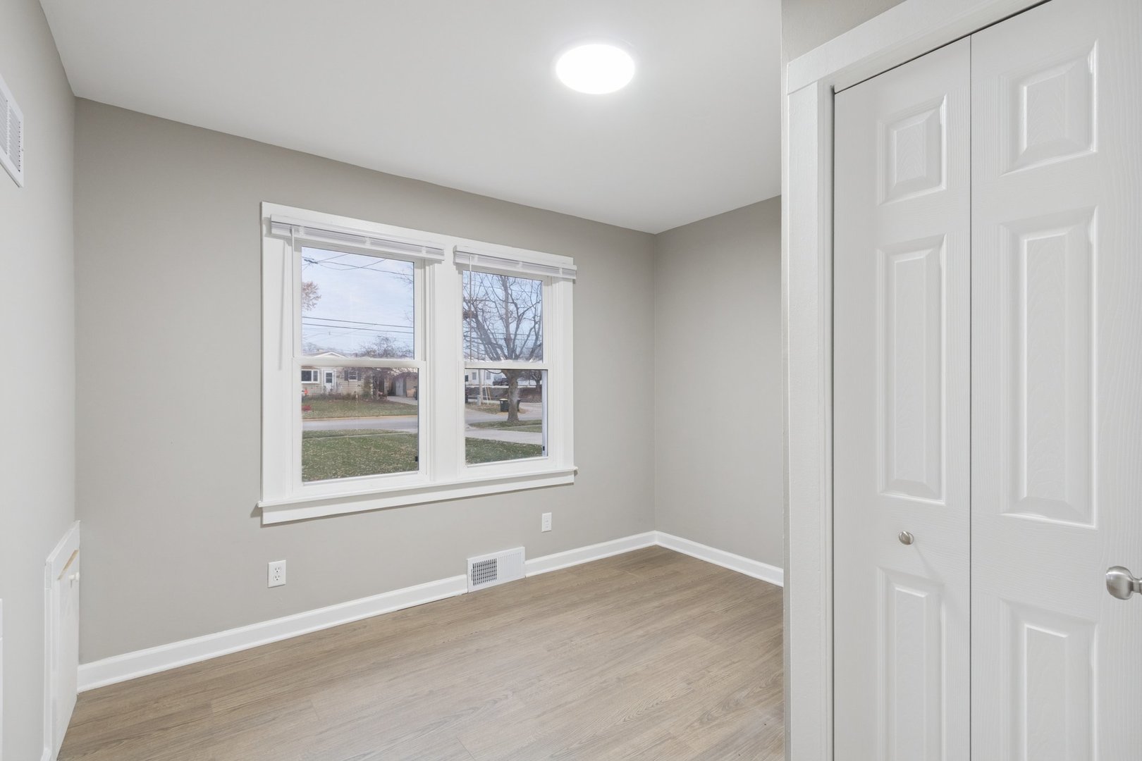 519 South Sycamore Street Genoa, IL 60135 - Photo 18 of 36 an empty room with a window