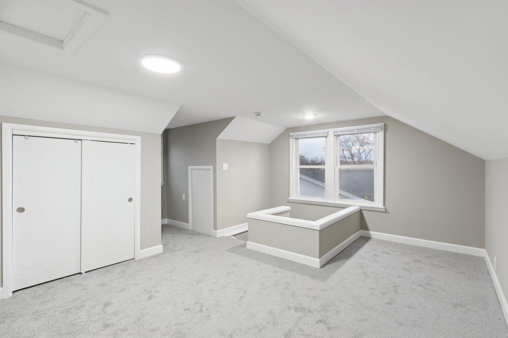 519 South Sycamore Street Genoa, IL 60135 - Photo 22 of 36 a spacious bedroom with a bed and a window