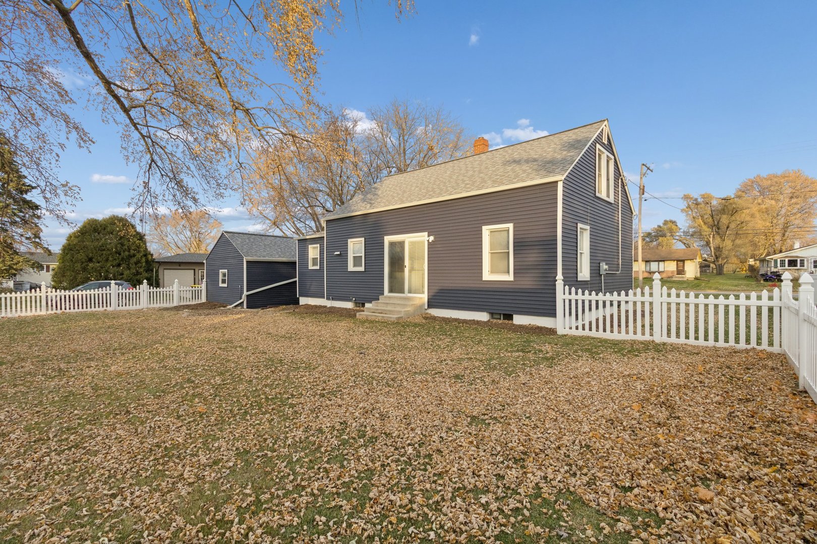 519 South Sycamore Street Genoa, IL 60135 - Photo 34 of 36 a front view of a house with a yard